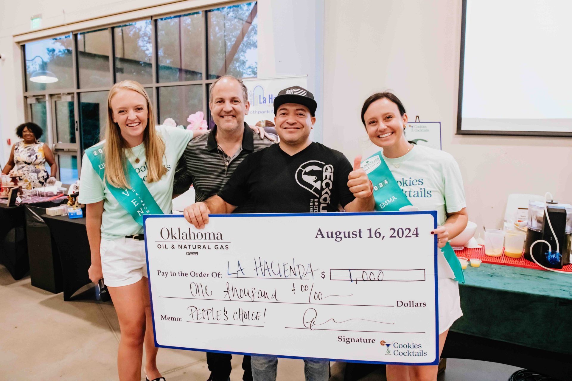 Cookies and Cocktails 24-La Hacienda receives a $1,000 check for winning People's Choice