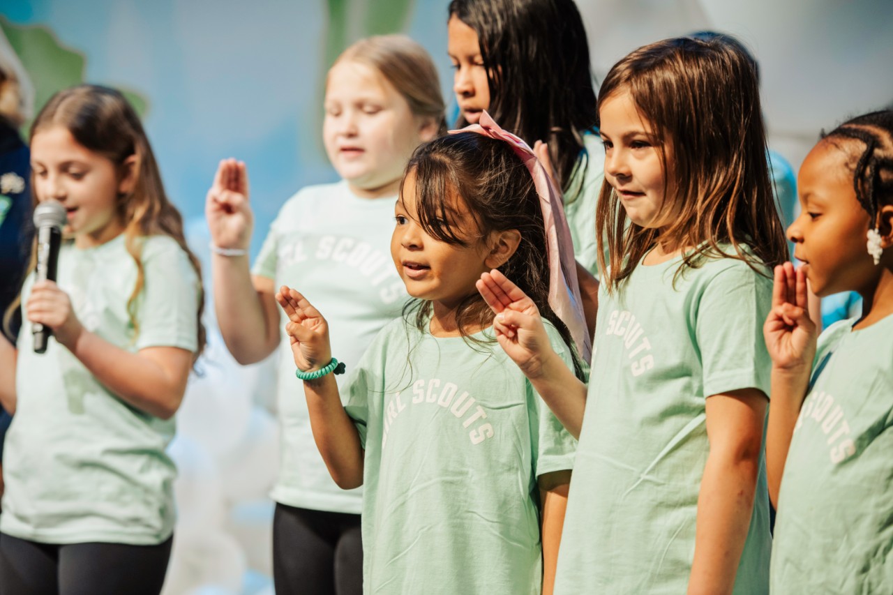 2025 JLLS Luncheon-Candance Nelson on stage with Christi Woodworth and Girl Scout