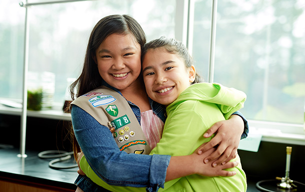 two girls hugging